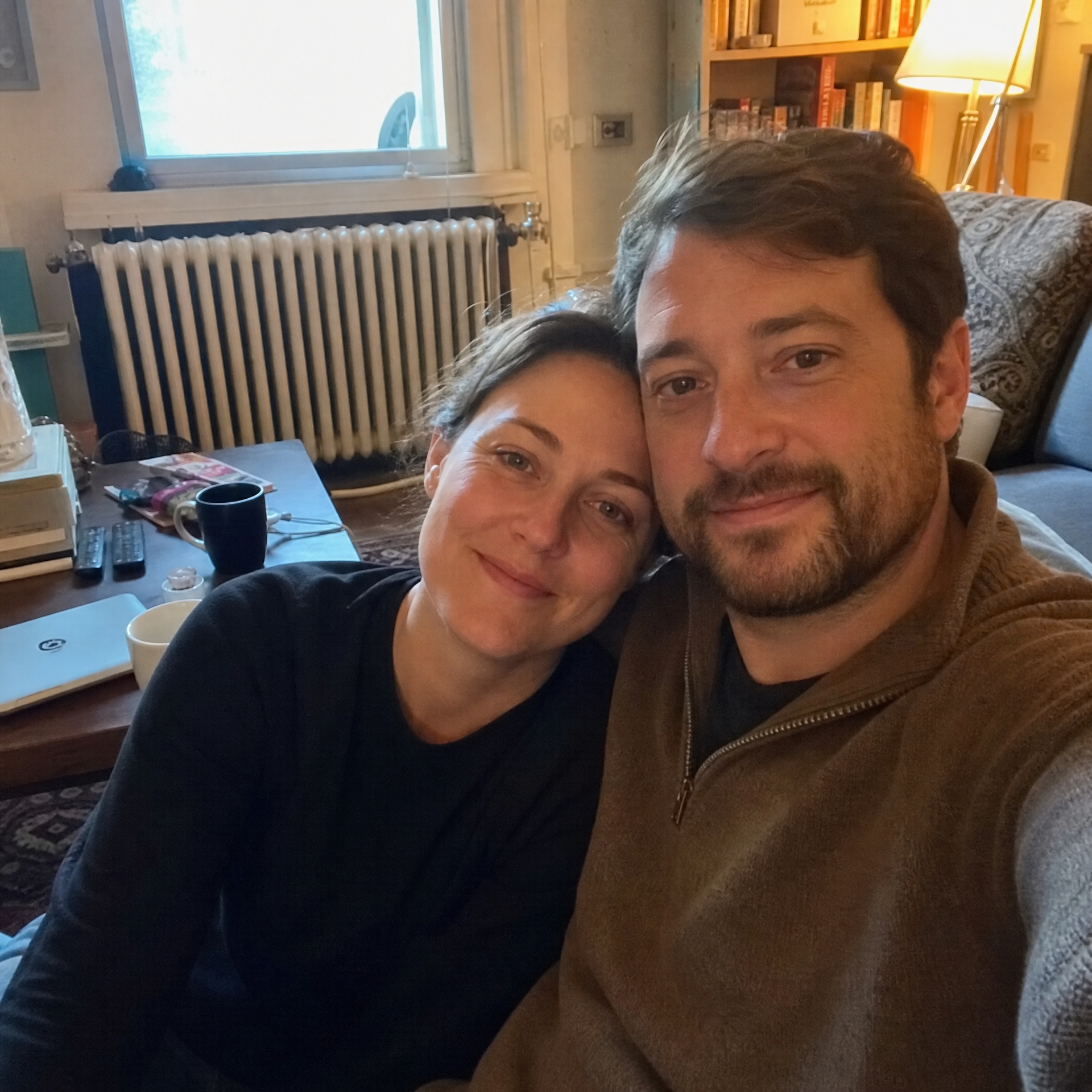 The original photograph of two people, before the portrait was rendered